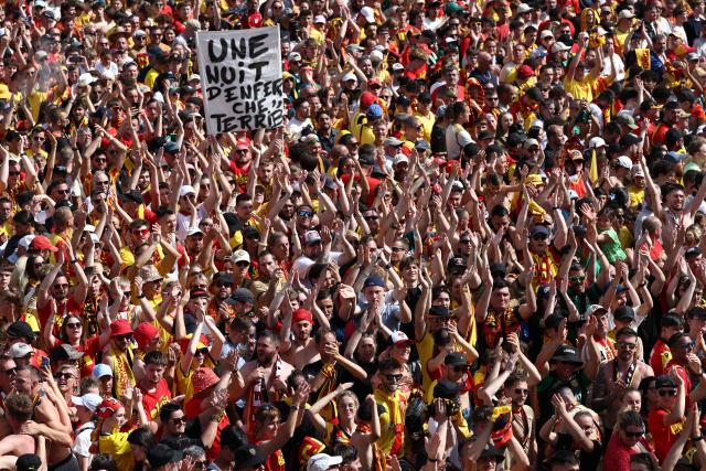 RC Lens supporters gather on the Place Jean-Jaures during celebrations following the club's victory in the French Cup final football match against OGC Nice, in Lens, northern France on May 23, 2026. (Photo by FRANCK FIFE / AFP)