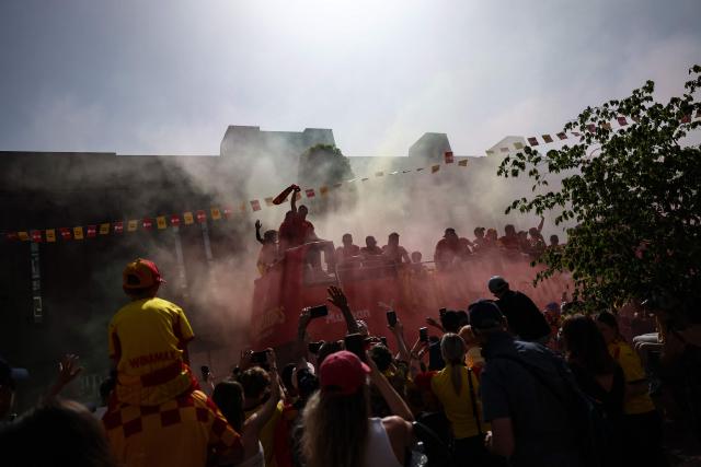 RC Lens' players parade for supporters atop a double-decker bus during celebrations following their victory in the French Cup final football match against OGC Nice, in Lens, northern France on May 23, 2026. (Photo by FRANCK FIFE / AFP)