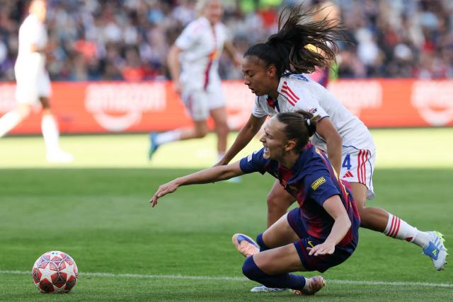Barcelona's Norwegian forward #10 Caroline Hansen tackles Lyon's French defender #04 Selma Bacha during the UEFA Women's Champions League final football match between FC Barcelona and Olympique Lyonnais (OL) at the Ullevaal Stadium in Oslo, Norway on May 23, 2026. (Photo by Odd ANDERSEN / AFP)