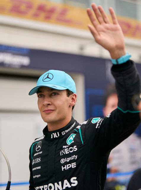 Mercedes' British driver George Russell waves to the fans after winning the Sprint race ahead of the 2026 Formula 1 Grand Prix du Canada at Circuit Gilles-Villeneuve in Montreal, Canada, on May 23, 2026. (Photo by Geoff Robins / AFP)