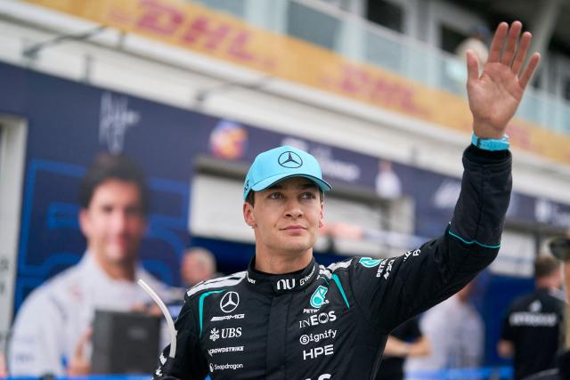 Mercedes' British driver George Russell waves to the fans after winning the Sprint race ahead of the 2026 Formula 1 Grand Prix du Canada at Circuit Gilles-Villeneuve in Montreal, Canada, on May 23, 2026. (Photo by Geoff Robins / AFP)