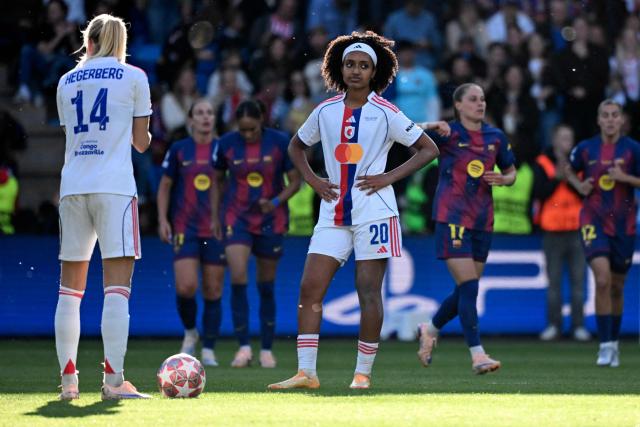Lyon's US midfielder #20 Lily Yohannes and Lyon's Norwegian forward #14 Ada Hegerberg react after Barcelona's Polish forward #17 Ewa Pajor scored her team's first goal during the UEFA Women's Champions League final football match between FC Barcelona and Olympique Lyonnais (OL) at the Ullevaal Stadium in Oslo, Norway on May 23, 2026. (Photo by Jonathan Nackstrand / AFP)