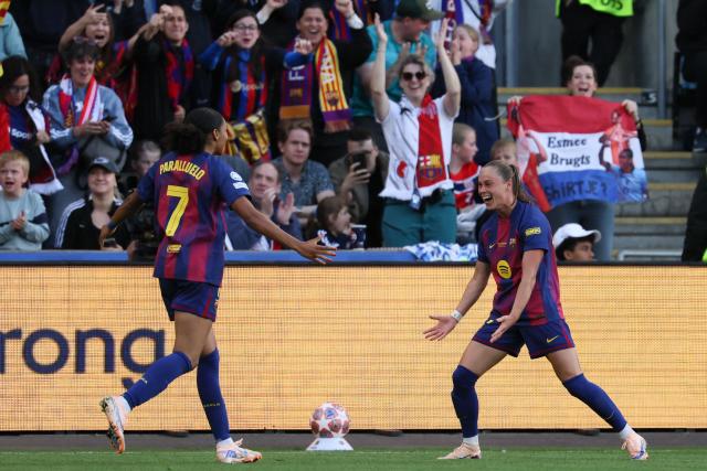 Barcelona's Polish forward #17 Ewa Pajor celebrates with Barcelona's Spanish forward #07 Salma Paralluelo after scoring her team's first goal during the UEFA Women's Champions League final football match between FC Barcelona and Olympique Lyonnais (OL) at the Ullevaal Stadium in Oslo, Norway on May 23, 2026. (Photo by Odd ANDERSEN / AFP)