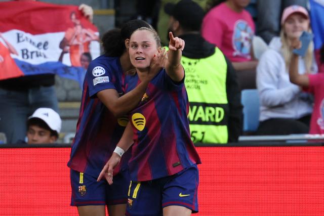 Barcelona's Polish forward #17 Ewa Pajor (R) celebrates with Barcelona's Spanish forward #07 Salma Paralluelo after scoring her team's first goal during the UEFA Women's Champions League final football match between FC Barcelona and Olympique Lyonnais (OL) at the Ullevaal Stadium in Oslo, Norway on May 23, 2026. (Photo by Odd ANDERSEN / AFP)