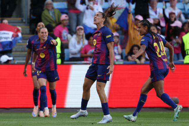 Barcelona's Spanish midfielder #12 Patricia Guijarro (C) celebrates after Barcelona's Polish forward #17 Ewa Pajor scored their team's first goal during the UEFA Women's Champions League final football match between FC Barcelona and Olympique Lyonnais (OL) at the Ullevaal Stadium in Oslo, Norway on May 23, 2026. (Photo by Odd ANDERSEN / AFP)