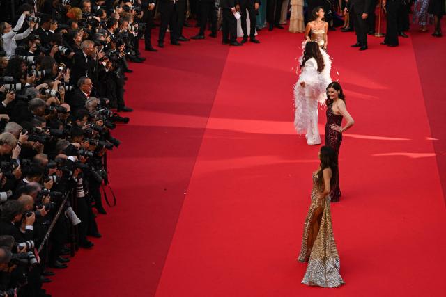 US actress Geena Davis (C) poses on the red carpet ahead of the closing ceremony of the 79th edition of the Cannes Film Festival in Cannes, southern France, on May 23, 2026. (Photo by Antonin THUILLIER / AFP)