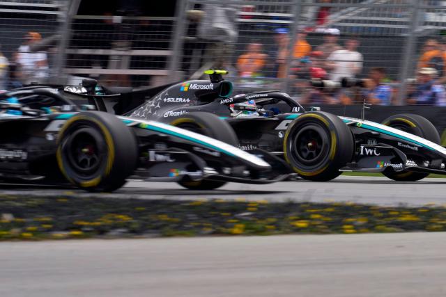 Mercedes' Italian driver Kimi Antonelli (R) tries to overtake his teammate Mercedes' British driver George Russell during the Sprint race ahead of the 2026 Formula 1 Grand Prix du Canada at Circuit Gilles-Villeneuve in Montreal, Canada, on May 23, 2026. (Photo by Geoff Robins / AFP)