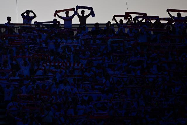 Stuttgart fans display their scarves prior to the German Cup (DFB Pokal) final football match FC Bayern Munich v VfB Stuttgart at the Olympic Stadium in Berlin, on May 23, 2026. (Photo by Tobias SCHWARZ / AFP) / DFB REGULATIONS PROHIBIT ANY USE OF PHOTOGRAPHS AS IMAGE SEQUENCES AND QUASI-VIDEO.