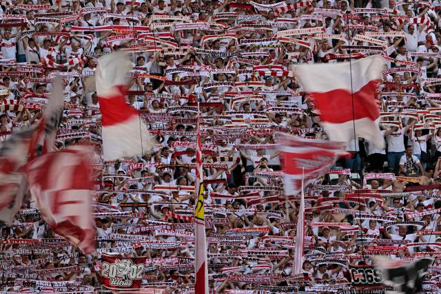 Stuttgart fans display their scarves prior to the German Cup (DFB Pokal) final football match FC Bayern Munich v VfB Stuttgart at the Olympic Stadium in Berlin, on May 23, 2026. (Photo by Tobias SCHWARZ / AFP) / DFB REGULATIONS PROHIBIT ANY USE OF PHOTOGRAPHS AS IMAGE SEQUENCES AND QUASI-VIDEO.