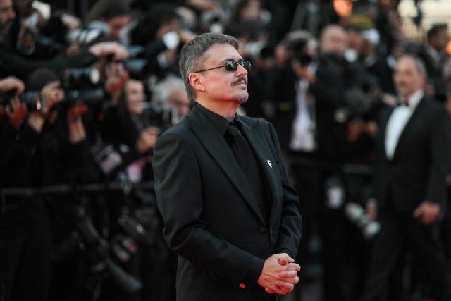 Romanian director, screenwriter and producer Cristian Mungiu poses on the red carpet ahead of the closing ceremony of the 79th edition of the Cannes Film Festival in Cannes, southern France, on May 23, 2026. (Photo by Olivier CHASSIGNOLE / AFP)