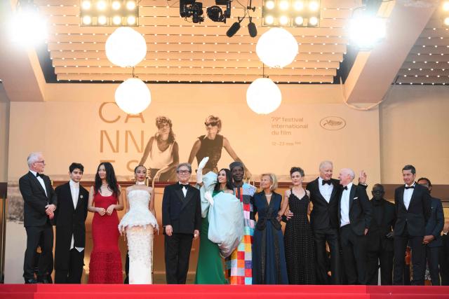 (From L) Cannes film festival director Thierry Fremaux, Member of the jury Chilean director and screenwriter Diego Cespedes, Member of the jury Chinese director and screenwriter Chloe Zhao, Member of the jury Irish-Ethiopian actress Ruth Negga, President of the jury South Korean director, screenwriter and producer Park Chan-wook, Member of the jury US actress and producer Demi Moore, Member of the jury Ivorian actor Isaach De Bankole, German media executive and President of the Cannes Film Festival Iris Knobloch, Member of the jury Belgian director and screenwriter Laura Wandel, Member of the jury Swedish actor Stellan Skarsgard and Member of the jury Scottish screenwriter Paul Laverty  pose on the red carpet ahead of the closing ceremony of the 79th edition of the Cannes Film Festival in Cannes, southern France, on May 23, 2026. (Photo by Olivier CHASSIGNOLE / AFP)