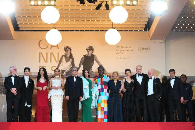 (From L) Cannes film festival director Thierry Fremaux, Member of the jury Chilean director and screenwriter Diego Cespedes, Member of the jury Chinese director and screenwriter Chloe Zhao, Member of the jury Irish-Ethiopian actress Ruth Negga, President of the jury South Korean director, screenwriter and producer Park Chan-wook, Member of the jury US actress and producer Demi Moore, Member of the jury Ivorian actor Isaach De Bankole, German media executive and President of the Cannes Film Festival Iris Knobloch, Member of the jury Belgian director and screenwriter Laura Wandel, Member of the jury Swedish actor Stellan Skarsgard and Member of the jury Scottish screenwriter Paul Laverty  pose on the red carpet ahead of the closing ceremony of the 79th edition of the Cannes Film Festival in Cannes, southern France, on May 23, 2026. (Photo by Olivier CHASSIGNOLE / AFP)