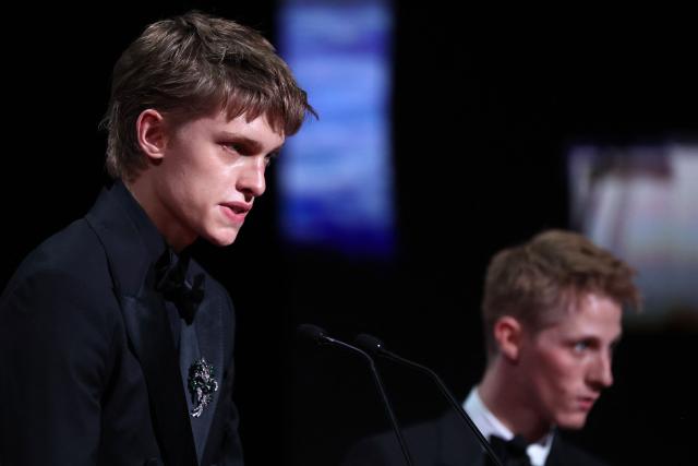 Belgian actor Emmanuel Macchia (L) and French actor Valentin Campagne celebrate on stage after winning ex-aequo the Best Actor Prize for the film "Coward" during the closing ceremony of the 79th edition of the Cannes Film Festival in Cannes, southern France, on May 23, 2026. (Photo by Valery HACHE / AFP)