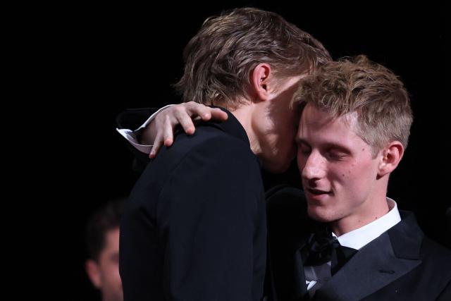 Belgian actor Emmanuel Macchia (L) and French actor Valentin Campagne celebrate on stage after winning ex-aequo the Best Actor Prize for the film "Coward" during the closing ceremony of the 79th edition of the Cannes Film Festival in Cannes, southern France, on May 23, 2026. (Photo by Valery HACHE / AFP)