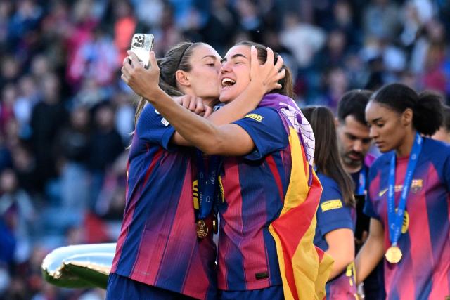 FC Barcelona players take a selfie following the victory ceremony after FC Barcelona won the UEFA Women's Champions League final football match between FC Barcelona and Olympique Lyonnais (OL) at the Ullevaal Stadium in Oslo, Norway on May 23, 2026. (Photo by Jonathan Nackstrand / AFP)