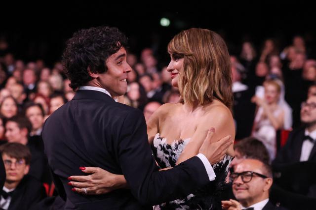 Spanish director, screenwriter and producer Javier Ambrossi celebrates with Spanish actress Penelope Cruz after winning the Best Director Prize for the film "La Bola Negra" during the closing ceremony of the 79th edition of the Cannes Film Festival in Cannes, southern France, on May 23, 2026. (Photo by Valery HACHE / AFP)