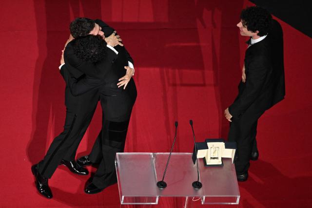 Spanish director, screenwriter and producer Javier Calvo and Spanish director, screenwriter and producer Javier Ambrossi celebrate after winning the Best Director Prize for the film "La Bola Negra" during the closing ceremony of the 79th edition of the Cannes Film Festival in Cannes, southern France, on May 23, 2026. (Photo by Antonin THUILLIER / AFP)