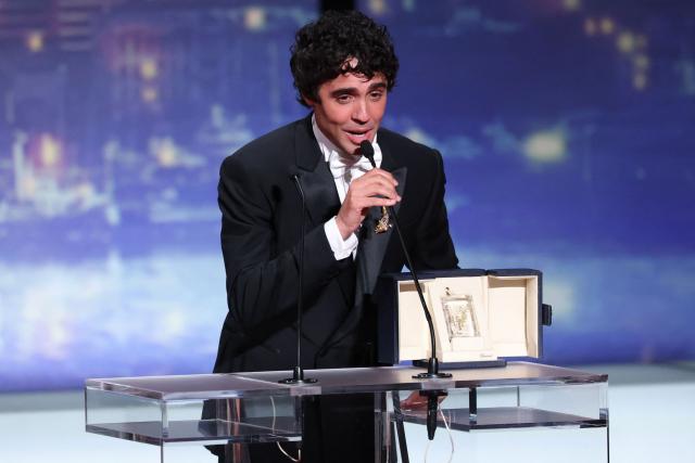 Spanish director, screenwriter and producer Javier Ambrossi celebrates on stage after winning the Best Director Prize for the film "La Bola Negra" during the closing ceremony of the 79th edition of the Cannes Film Festival in Cannes, southern France, on May 23, 2026. (Photo by Sameer AL-DOUMY / AFP)