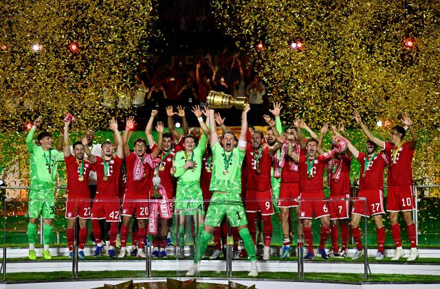 Bayern Munich's German goalkeeper #01 Manuel Neuer lifts the trophy after the German Cup (DFB Pokal) final football match FC Bayern Munich v VfB Stuttgart at the Olympic Stadium in Berlin, on May 23, 2026. (Photo by Tobias SCHWARZ / AFP) / DFB REGULATIONS PROHIBIT ANY USE OF PHOTOGRAPHS AS IMAGE SEQUENCES AND QUASI-VIDEO.