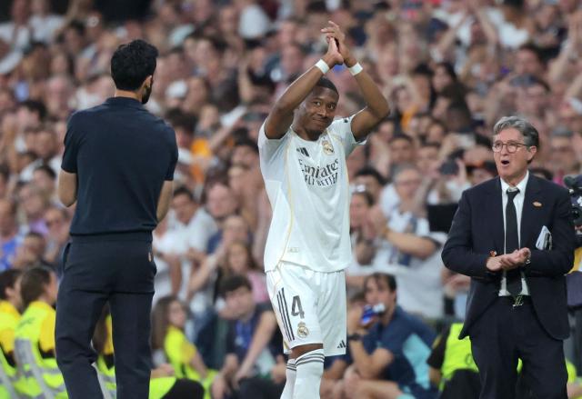 Real Madrid's Austrian defender #04 David Alaba applauds as he leaves the pitch during the Spanish league football match between Real Madrid CF and Athletic Club Bilbao at Santiago Bernabeu Stadium in Madrid on May 23, 2026. (Photo by Pierre-Philippe MARCOU / AFP)