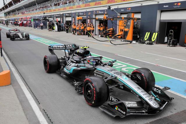 Mercedes' Italian driver Kimi Antonelli (R) and Audi's German driver Nico Hulkenberg (L) drive in pit lane during the qualifying session for the 2026 Formula 1 Grand Prix du Canada at Circuit Gilles-Villeneuve in Montreal, Canada, on May 23, 2026. (Photo by Cristobal Herrera-Ulashkevich / POOL / AFP)