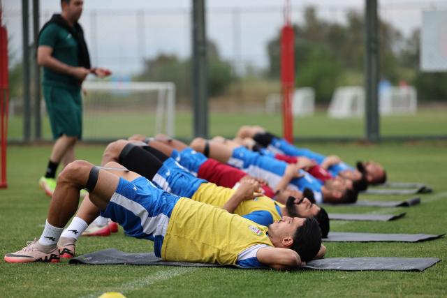 (FILES) Iran's players stretch during a training session at their base camp in Antalya on May 19, 2026. Iran are moving their World Cup training base to Mexico after football's world governing body FIFA approved a request to transfer it from Tucson, Arizona, the head of Iran's football federation said on May 23. (Photo by Oner SAN / AFP)
