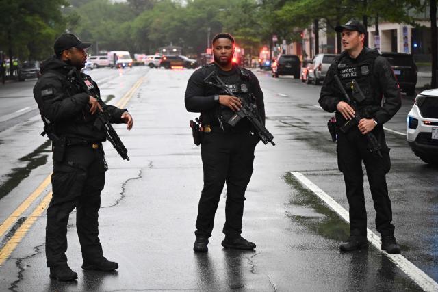 Police vehicles and armed Secret Service agents are seen near the White House in Washington, DC, on May 23, 2026. Police and security forces swarmed the area around the White House on the evening of May 23 after reports of shots fired, AFP journalists said. US President Donald Trump was at the White House at the time as he worked to negotiate a deal with Iran. (Photo by Alex WROBLEWSKI / AFP)