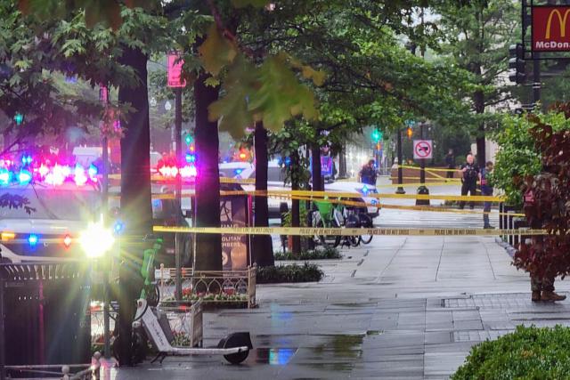 Police tape blocks off a sidewalk near the White House in Washington, DC, on May 23, 2026. Police and security forces swarmed the area around the White House on the evening of May 23 after reports of shots fired, AFP journalists said. US President Donald Trump was at the White House at the time as he worked to negotiate a deal with Iran. (Photo by Ulysse BELLIER / AFP)