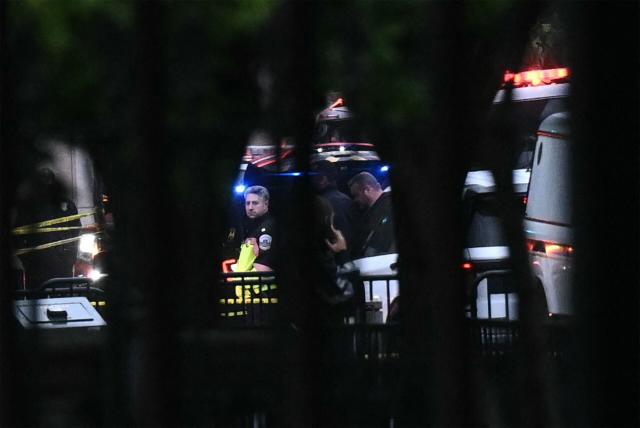 Washington DC police work near the Eisenhower Executive Office Building near the White House in Washington, DC, on May 23, 2026. Police and security forces swarmed the area around the White House on the evening of May 23 after reports of shots fired, AFP journalists said. US President Donald Trump was at the White House at the time as he worked to negotiate a deal with Iran. (Photo by Brendan SMIALOWSKI / AFP)