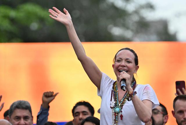 Venezuelan opposition leader Maria Corina Machado gestures as she speaks to venezuelan diaspora during a rally in Panama City on May 23, 2026. Machado is visiting Panama as part of a regional tour, during which she is set to meet with members of the Venezuelan diaspora and Panamanian President Jose Raul Mulino. (Photo by MARTIN BERNETTI / AFP)