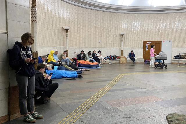 Residents take shelter in a metro station in central Kyiv during a Russian air attack on the Ukrainian capital early on May 24, 2026. A "mass ballistic missile attack" pounded Kyiv early on May 24, military authorities said, with AFP journalists hearing heavy explosions, after Ukraine warned it was expecting a major Russian assault. (Photo by Ania TSOUKANOVA / AFP)