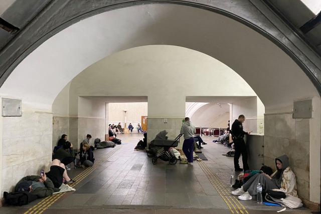 Residents take shelter in a metro station in central Kyiv during a Russian air attack on the Ukrainian capital early on May 24, 2026. A "mass ballistic missile attack" pounded Kyiv early on May 24, military authorities said, with AFP journalists hearing heavy explosions, after Ukraine warned it was expecting a major Russian assault. (Photo by Ania TSOUKANOVA / AFP)