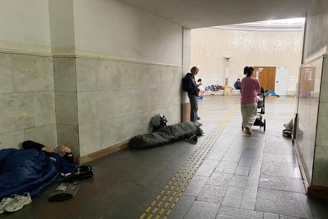 Residents take shelter in a metro station in central Kyiv during a Russian air attack on the Ukrainian capital early on May 24, 2026. A "mass ballistic missile attack" pounded Kyiv early on May 24, military authorities said, with AFP journalists hearing heavy explosions, after Ukraine warned it was expecting a major Russian assault. (Photo by Ania TSOUKANOVA / AFP)