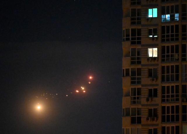 This photo shows Ukrainian air defence firing at Russian drones above Kyiv during a Russian drone and missile strike on the Ukrainian capital on May 24, 2026, amid the Russian invasion in Ukraine. A large ballistic missile attack pounded Kyiv early on May 24, authorities said, wounding at least five people after Moscow threatened retaliation for strikes in Russian-occupied eastern Ukraine. (Photo by Sergei SUPINSKY / AFP)