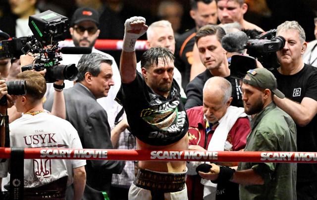 Ukraine’s Oleksandr Usyk reacts after defeating Netherlands’ Rico Verhoeven (off frame) by TKO during their WBC World Heavyweight Championship 'Glory in Giza' boxing match at the Pyramids of Giza on May 23, 2026. Heavyweight boxing king Oleksandr Usyk retained his titles after a dramatic and controversial stoppage victory over kick-boxer Rico Verhoeven with a second left of the 11th round in Egypt on May 23. (Photo by Khaled DESOUKI / AFP)