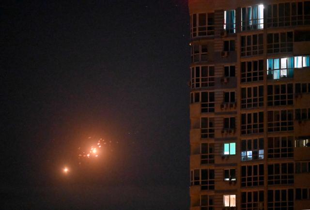 This photo shows Ukrainian air defence firing at Russian drones above Kyiv during a Russian drone and missile strike on the Ukrainian capital on May 24, 2026, amid the Russian invasion in Ukraine. A large ballistic missile attack pounded Kyiv early on May 24, authorities said, wounding at least five people after Moscow threatened retaliation for strikes in Russian-occupied eastern Ukraine. (Photo by Sergei SUPINSKY / AFP)