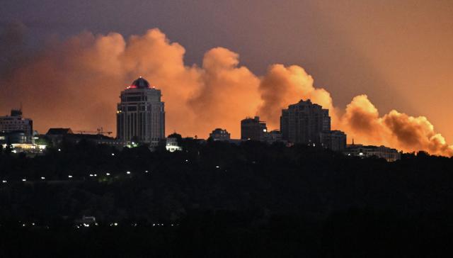 Smoke rises above Kyiv during a Russian strike on the Ukrainian capital on May 24, 2026, amid the Russian invasion in Ukraine. A large ballistic missile attack pounded Kyiv early on May 24, authorities said, wounding at least five people after Moscow threatened retaliation for strikes in Russian-occupied eastern Ukraine. (Photo by Genya Savilov / AFP)