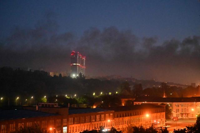 Smoke rises above Kyiv during a Russian strike on the Ukrainian capital on May 24, 2026, amid the Russian invasion in Ukraine. A large ballistic missile attack pounded Kyiv early on May 24, authorities said, wounding at least five people after Moscow threatened retaliation for strikes in Russian-occupied eastern Ukraine. (Photo by Sergei SUPINSKY / AFP)