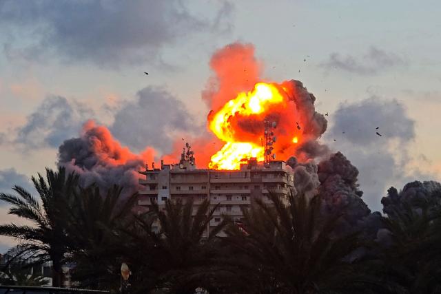 A fireball erupts from a building following an Israeli strike in Tyre, southern Lebanon, on May 28, 2026. The Israeli military said on May 28 it had begun new strikes on Hezbollah infrastructure around the southern Lebanese city of Tyre after issuing an evacuation warning to its residents. (Photo by KAWANT HAJU / AFP)