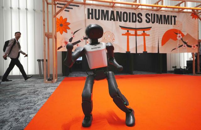 The Booster K1 by Booster Robotics, a compact humanoid robot designed for education, research, and competition, performs a dance at the Humanoids Summit Tokyo 2026 in Tokyo on May 28, 2026. (Photo by Kazuhiro NOGI / AFP)
