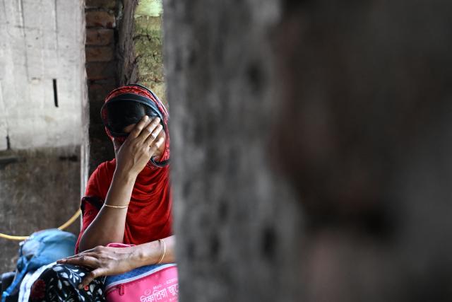 A Bangladeshi migrant who had allegedly illegally crossed border, arrives for verification near the Indian Border Security Force (BSF) camp on the outskirts of Kolkata on May 28, 2026. Hundreds of people in India's border region with Bangladesh have fled to the frontier, police said on May 27, after the government ordered the construction of detention centres for undocumented Bangladeshi migrants and Rohingya refugees. (Photo by Dibyangshu SARKAR / AFP)