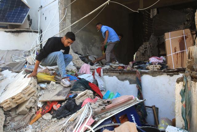 Residents search the rubble of their destroyed home following a dawn Israeli air raid on the southern Lebanese city of Sidon  on May 28, 2026. Israel the previous day had declared all areas south of Lebanon's Zahrani River - an area roughly 40 kilometres (25 miles) from the border and including Tyre - as "combat zones" and told residents to evacuate ahead of attacks against Iran-backed Hezbollah. Lebanon was drawn into the Middle East war on March 2 when Tehran-backed militant group Hezbollah launched attacks on Israel to avenge the killing of the Iranian leader. Israel has responded with broad strikes across Lebanon and a ground offensive. (Photo by MAHHMOUD ZAYYAT / AFP)