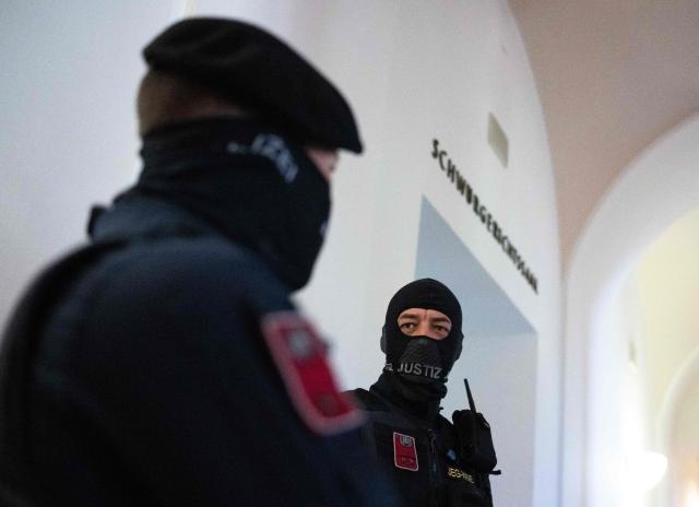 Justice officers wait outside the courtroom as the verdict in a trial over a plot to attack a Taylor Swift concert in Vienna is awaited at a court in Wiener Neustadt, Austria, on May 28, 2026. The court in Wiener Neustadt, near Vienna, is set to deliver its verdict late May 28 afternoon in the case of a 21-year-old Austrian man accused of plotting an Islamist attack on a Taylor Swift concert. (Photo by Joe Klamar / AFP)