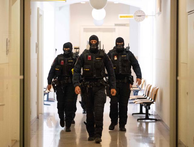 Justice officers arrive at the courtroom as the verdict in a trial over a plot to attack a Taylor Swift concert in Vienna is awaited at a court in Wiener Neustadt, Austria, on May 28, 2026. The court in Wiener Neustadt, near Vienna, is set to deliver its verdict late May 28 afternoon in the case of a 21-year-old Austrian man accused of plotting an Islamist attack on a Taylor Swift concert. (Photo by Joe Klamar / AFP)