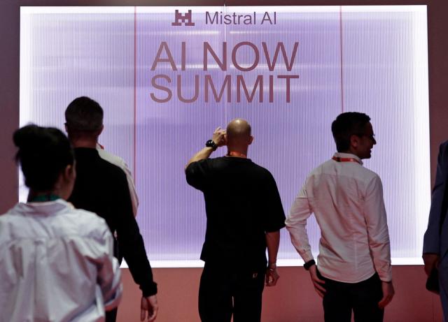 People arrive to attend French AI developer Mistral's "AI Now Summit" event at the Carrousel du Louvre in Paris on May 28, 2026. (Photo by STEPHANE DE SAKUTIN / AFP)