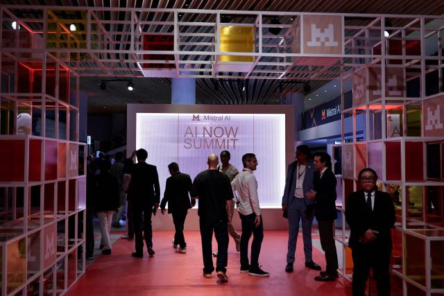 People arrive to attend French AI developer Mistral's "AI Now Summit" event at the Carrousel du Louvre in Paris on May 28, 2026. (Photo by STEPHANE DE SAKUTIN / AFP)
