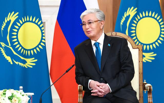 In this pool photograph distributed by the Russian state agency Sputnik Kazakh President Kassym-Jomart Tokayev meets with Russian President at the Palace of Independence during his state visit to Kazakhstan in Astana on May 27, 2026. (Photo by Alexander KAZAKOV / POOL / AFP)