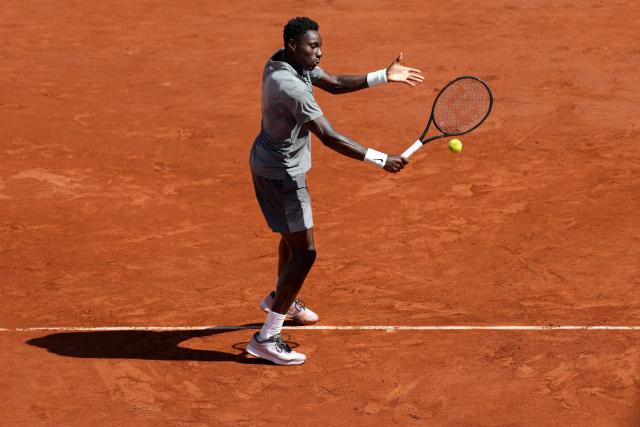 France's Moise Kouame plays a backhand return to Paraguay's Adolfo Daniel Vallejo during their men's singles match on day 5 of the French Open tennis tournament on Court Suzanne-Lenglen at the Roland-Garros Complex in Paris on May 28, 2026. (Photo by Dimitar DILKOFF / AFP)