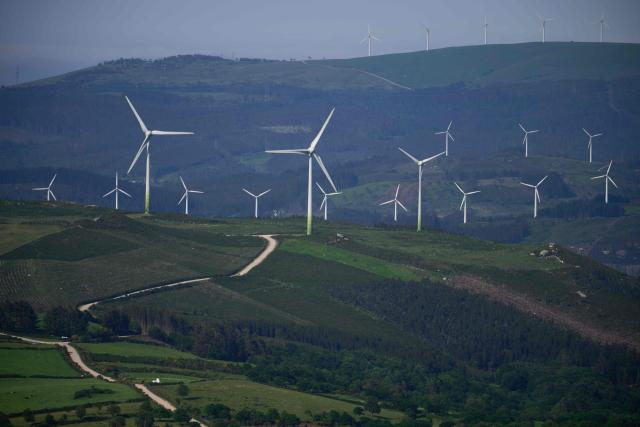 Wind turbines are pictured in the hills of the Coruxeiras wind farm, in Muras, some 130 km from Santiago de Compostela , northwestern Spain, on May 26, 2026. (Photo by MIGUEL RIOPA / AFP)