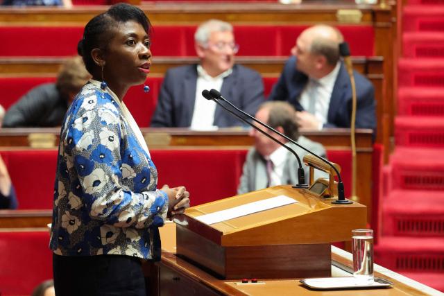 La France Insoumise - Nouveau Front Populaire's MP Daniele Obono (L) speaks during a session to debate a proposed bill aimed at abolishing the slavery-related laws at The National Assembly, France's lower house parliament, in Paris on May 28, 2026. These laws, known as Code Noir ("Black Code") classified enslaved people as "chattels" that could be acquired by a master in the same way as property, or established penalties for escapeincluding the cutting off of ears, branding with a lily, and even the death penalty. (Photo by Ludovic MARIN / AFP)